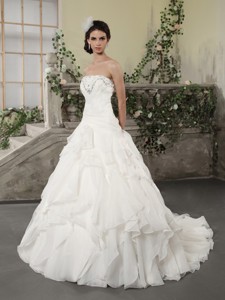 White Strapless Ruffled Wedding Dress With Chapel Train And Beading
