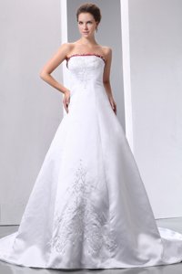 Luxurious Strapless Chapel Train Satin Embroidery With Beading Wedding Dress