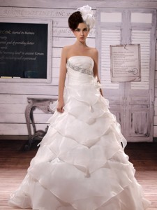 Gorgeous Clasp Handle Ruffled Layers Beaded And Hand Made Flower Wedding Dress With Chapel Trai