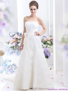 White Strapless Laced Wedding Dress With Bownot And Brush Train