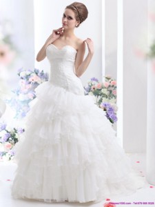 White Brush Train Wedding Dress With Ruffled Layers And Sequins